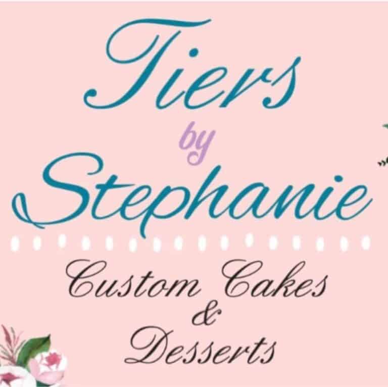 Logo for "Tiers by Stephanie" featuring text "Custom Cakes & Desserts" on a pink background with floral accents in the corners.